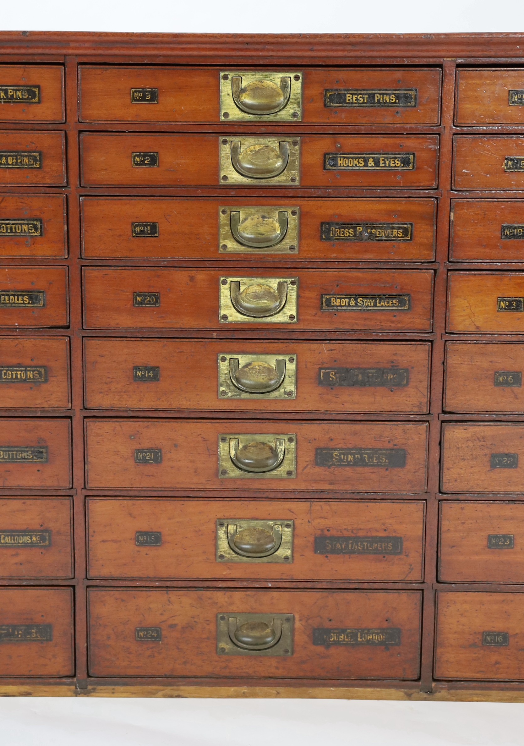 A Victorian mahogany haberdashery cabinet of twenty four drawers, width 136cm depth 35cm height 82cm